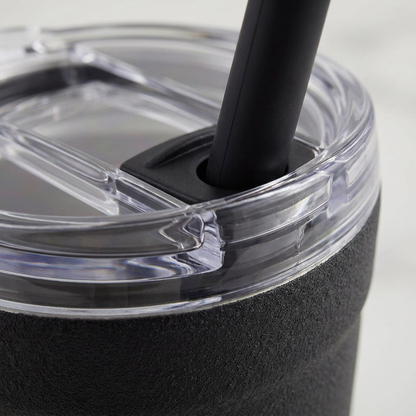 An extreme close-up of the clear lid and black straw seal on the bubba Envy S tumbler, highlighting its secure fit.