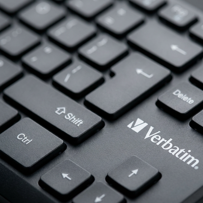 Macro photograph showing the Verbatim logo on the dark grey wireless keyboard keys.