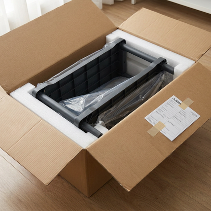 A person carefully unboxing the grey Rakabot two-tier boot rack, showing its secure packaging with foam inserts and the CUSMA form attached to the side of the neutral cardboard shipping box.