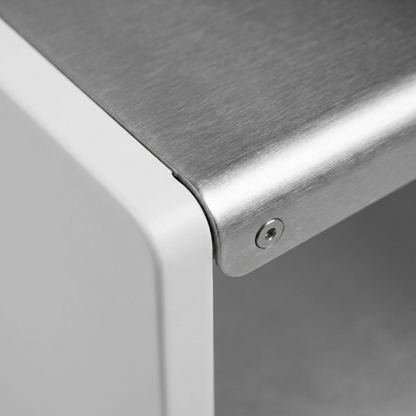 A close-up photograph highlighting the brushed stainless steel shelf and precision connector on the white panel of the RAKABOT Titan shoe rack.