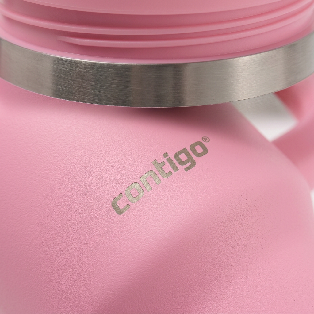 A detailed macro photograph focusing on the textured pink finish, the etched Contigo logo, and the edge of the stainless steel rim of a tumbler.