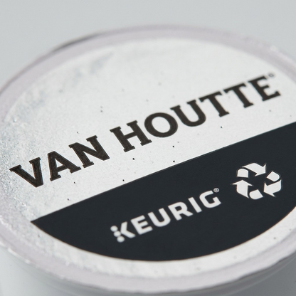 Macro close-up of a Van Houtte Breakfast Blend K-Cup pod foil lid, highlighting fine text and recycle mark.