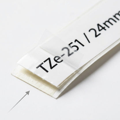 Macro detail of Brother TZe-251 24mm tape showing the laminated surface and clean black printing.