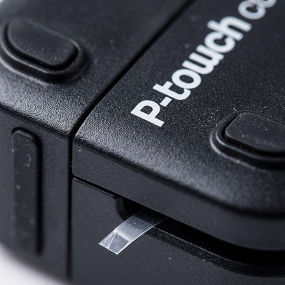 Macro detail of the Brother PT-P710BT showing the matte black texture and clear label tape exit.